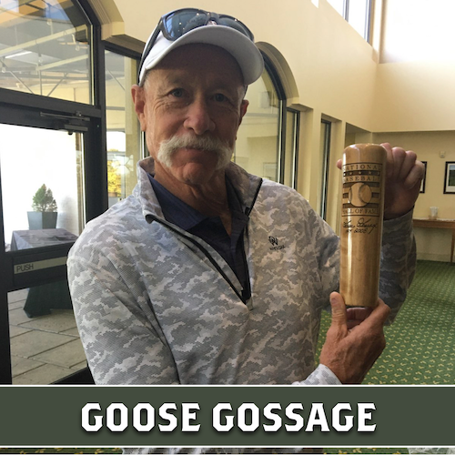 Goose Gossage holding a wooden Dugout Mugs baseball bat mug.