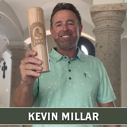Kevin Millar smiling and raising a wooden Dugout Mugs baseball bat mug.